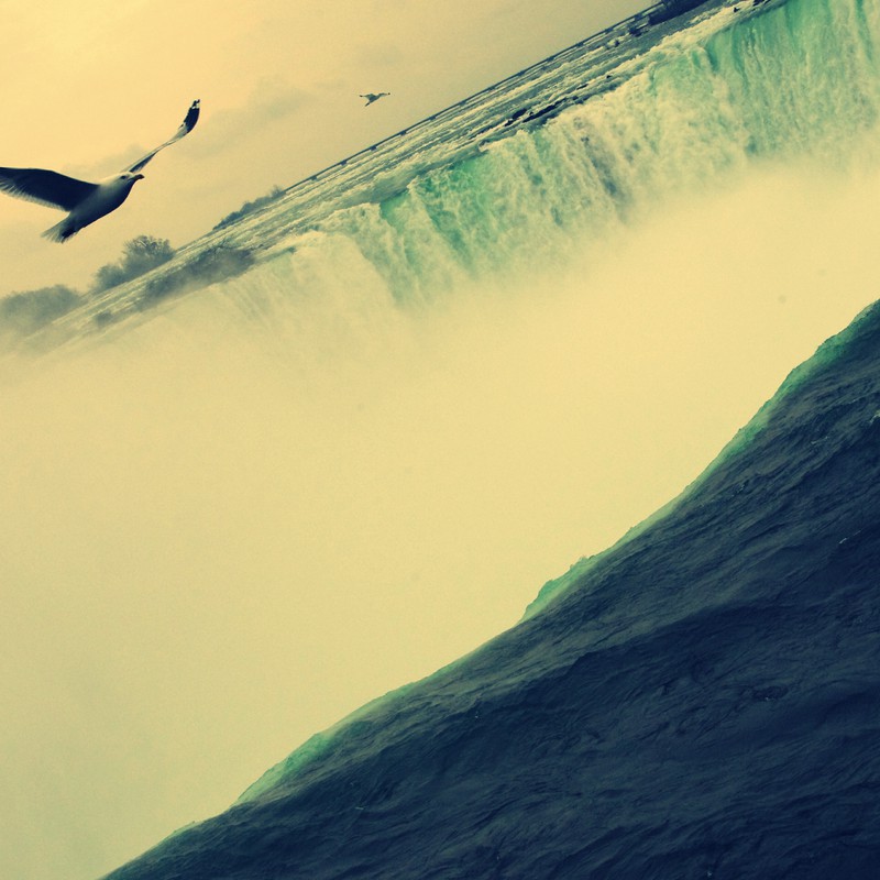 We fly above the falls to cross the border.